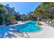 Beautiful tropical pool with lounge chairs offers luxury relaxation by the beach at 1401 Ocean Club Dr, Isle of Palms, SC 29451