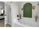 Bathroom showcasing a soaking tub, a shower, and decorative wall sconces at 147 Moon Dance Ln, Summerville, SC 29483