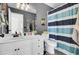 Bathroom with a single sink vanity, a large mirror, and a bathtub with a shower curtain at 147 Moon Dance Ln, Summerville, SC 29483