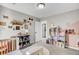 Cozy bedroom with carpeted floors, a dollhouse, and a small bookshelf at 147 Moon Dance Ln, Summerville, SC 29483
