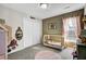 Charming bedroom with carpeted floors, a crib, and a double door closet at 147 Moon Dance Ln, Summerville, SC 29483