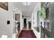 Inviting foyer with hardwood floors, staircase, and view into living spaces at 147 Moon Dance Ln, Summerville, SC 29483