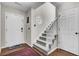 Inviting foyer featuring hardwood floors, white front door, staircase and octagon window at 147 Moon Dance Ln, Summerville, SC 29483