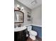 Elegant half bath featuring a stylish vanity, tiled backsplash, and modern fixtures at 147 Moon Dance Ln, Summerville, SC 29483