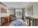 Bright home office featuring hardwood floors, a large window, and custom built-in shelving at 147 Moon Dance Ln, Summerville, SC 29483