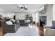 Spacious living room with fireplace and view into modern kitchen with white cabinets at 147 Moon Dance Ln, Summerville, SC 29483