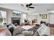 Comfortable living room with fireplace, ceiling fan and plush sectional sofa at 147 Moon Dance Ln, Summerville, SC 29483