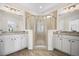 Beautiful bathroom featuring dual sinks, granite countertops, white cabinets, and a glass-enclosed shower for a spa-like experience at 2014 Barn Swallow Rd, Summerville, SC 29483