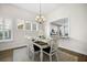 Dining area features a table set for a meal near a window with bright, natural light at 2014 Barn Swallow Rd, Summerville, SC 29483