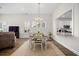 Elegant dining area with a view into the kitchen, perfect for Gathering meals and entertaining at 2014 Barn Swallow Rd, Summerville, SC 29483