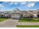 Charming single-story home with a two-car garage and manicured lawn at 2014 Barn Swallow Rd, Summerville, SC 29483