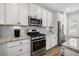 Well-equipped kitchen features stainless steel appliances, granite countertops, and white cabinets at 2014 Barn Swallow Rd, Summerville, SC 29483
