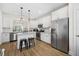 Spacious kitchen with a large stainless steel refrigerator and an eat-in island at 2014 Barn Swallow Rd, Summerville, SC 29483