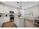Bright kitchen featuring an island, stainless steel appliances, and abundant natural light at 2014 Barn Swallow Rd, Summerville, SC 29483