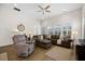 Inviting living room with plush seating, a ceiling fan, and lots of windows at 2014 Barn Swallow Rd, Summerville, SC 29483