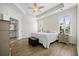 Serene main bedroom with tray ceiling, hardwood floors, and lots of natural light at 2014 Barn Swallow Rd, Summerville, SC 29483