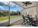 Relax on this screened porch with stylish table and chairs, and enjoy the outdoor view at 2014 Barn Swallow Rd, Summerville, SC 29483