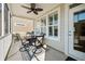 Enjoy outdoor living on this covered patio with stylish table and chairs at 2014 Barn Swallow Rd, Summerville, SC 29483
