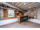 Finished basement featuring exposed ceiling beams, a bar area, and wood paneled walls at 207 S Gum St, Summerville, SC 29483