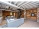 Finished basement featuring a spiral staircase, wood paneled wall, and shelving at 207 S Gum St, Summerville, SC 29483