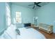 This bedroom features hardwood floors, a ceiling fan, a dresser, and a crib at 207 S Gum St, Summerville, SC 29483