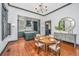 Dining area featuring hardwood floors and a view into the stylish kitchen at 207 S Gum St, Summerville, SC 29483