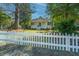Charming home with a white picket fence and inviting front porch at 207 S Gum St, Summerville, SC 29483