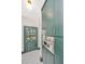 Elegant kitchen with stainless appliances, custom green cabinets, and a door that leads outside at 207 S Gum St, Summerville, SC 29483