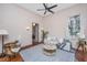 Comfortable living room with a gray sofa, hardwood floors and a ceiling fan at 207 S Gum St, Summerville, SC 29483