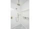 This shower features white subway tile, bronze fixtures, a built-in shelf, and patterned tile flooring at 207 S Gum St, Summerville, SC 29483