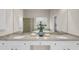 Bathroom featuring double sinks with granite counters, white cabinetry, and a large mirror at 2124 Tall Grass Cir, Mount Pleasant, SC 29466