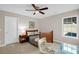 Cozy bedroom with a ceiling fan, a single bed, and a window that offers a view of the yard at 2124 Tall Grass Cir, Mount Pleasant, SC 29466