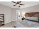 Bedroom with a bed, ceiling fan, and access to another room, offering a flexible living space at 2124 Tall Grass Cir, Mount Pleasant, SC 29466