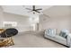 Bright bonus room with neutral carpet, ceiling fan, and comfortable couches at 2124 Tall Grass Cir, Mount Pleasant, SC 29466