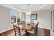 Elegant dining room with natural light, tray ceiling, and wood furnishings at 2124 Tall Grass Cir, Mount Pleasant, SC 29466