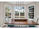 Dining room with three-window bay and wood table perfect for Gathering meals and gatherings at 2124 Tall Grass Cir, Mount Pleasant, SC 29466