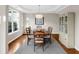 Elegant dining room with hardwood floors, tray ceiling, and a china cabinet at 2124 Tall Grass Cir, Mount Pleasant, SC 29466