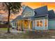 Exterior view of a charming home with a screened porch and picturesque backyard at 2124 Tall Grass Cir, Mount Pleasant, SC 29466
