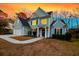 Charming two-story home features a well-manicured lawn and inviting entrance at 2124 Tall Grass Cir, Mount Pleasant, SC 29466