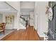 Inviting foyer with soaring ceilings, hardwood floors, and classic staircase at 2124 Tall Grass Cir, Mount Pleasant, SC 29466