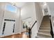 Spacious foyer featuring hardwood floors, a staircase, and a view into the dining area at 2124 Tall Grass Cir, Mount Pleasant, SC 29466