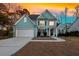 Beautiful two-story home with well-maintained landscaping, a two-car garage, and a welcoming front porch at 2124 Tall Grass Cir, Mount Pleasant, SC 29466