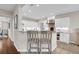 Open-concept kitchen with white cabinets, bar seating, and stainless steel appliances at 2124 Tall Grass Cir, Mount Pleasant, SC 29466