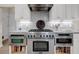 Well-equipped kitchen features a stainless steel stove, oven, microwave, and white cabinets at 2124 Tall Grass Cir, Mount Pleasant, SC 29466