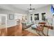 Spacious living room with hardwood floors, a ceiling fan, and a view into the kitchen and dining area at 2124 Tall Grass Cir, Mount Pleasant, SC 29466