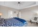 Spacious bedroom with a ceiling fan, neutral walls and access to the main bathroom at 2124 Tall Grass Cir, Mount Pleasant, SC 29466