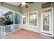 Relaxing screened porch with tile floor and ceiling fan at 2124 Tall Grass Cir, Mount Pleasant, SC 29466