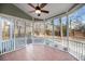 Cozy screened porch features a ceiling fan and backyard views at 2124 Tall Grass Cir, Mount Pleasant, SC 29466