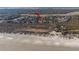 Gorgeous aerial view of beachfront home, surrounded by trees and greenery with ocean access at 2238 Catesbys Blf, Seabrook Island, SC 29455