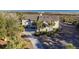 Aerial view of a coastal home surrounded by lush greenery near the ocean at 2238 Catesbys Blf, Seabrook Island, SC 29455